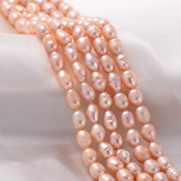 Freshwater pearl, full strand, peach, rice, ca. 3,5x2,5mm, A-grade, appx. 100pcs