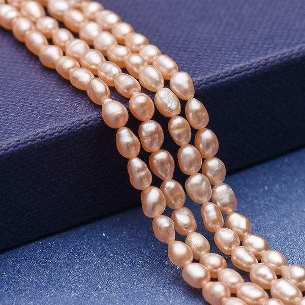 Freshwater pearl, full Strand, peach, rice, 5x3,5 mm, ca. 70pcs