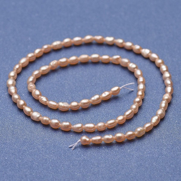 Freshwater pearl, full Strand, peach, rice, 5x3,5 mm, ca. 70pcs