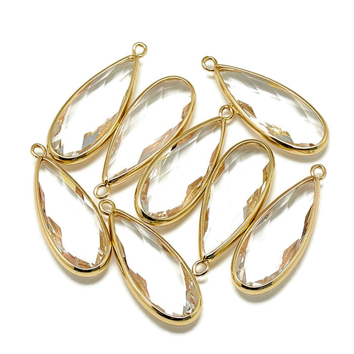 Glass charm, gilded teardrop, clear, 37x14mm, 1pc.