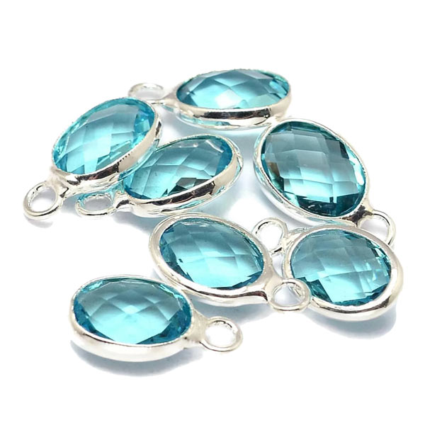 Glass charm, silver plated, oval, light sky blue, 12x7mm, 1pc