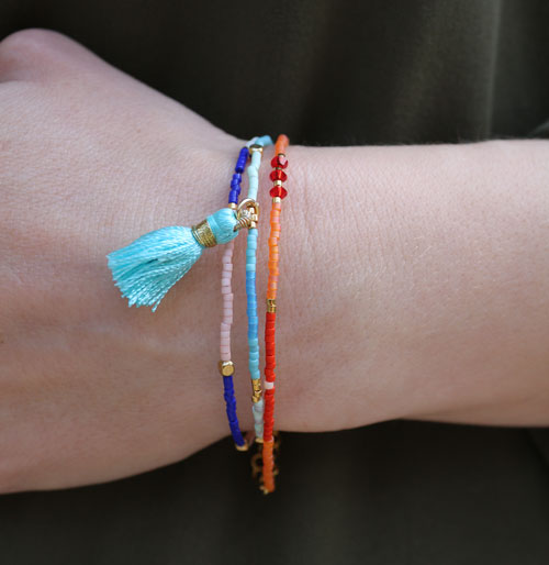 Tassel, white with golden eye, 45mm, 1pc.