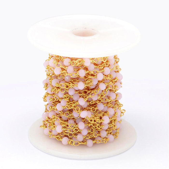 Chain of faceted glass beads, pink, gold-plated brass, 4 mm, 50 cm
