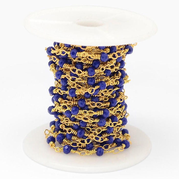 Chain of faceted glass beads, prussian blue, gold-plated brass, 4 mm, 50 cm