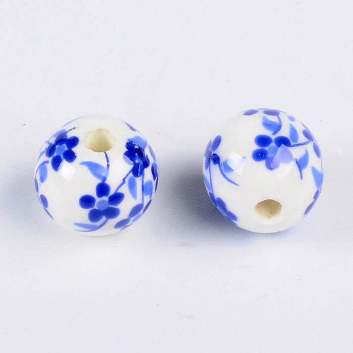 Porcelain bead, white with blue flowers, round, 12 mm, 4 pieces