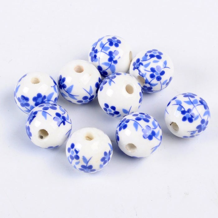 Porcelain bead, white with blue flowers, round, 12 mm, 4 pieces