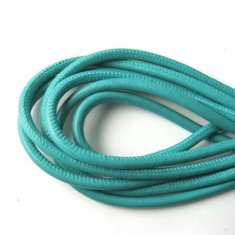 Stitched leather cord, round, turquoise, 5mm, 20cm. If you purchase more than one unit, cord will be delivered uncut.
