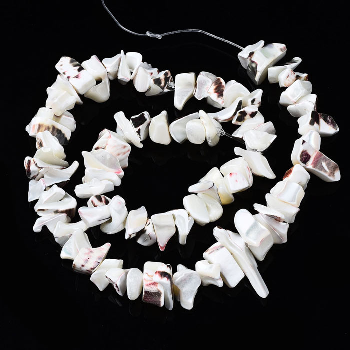 Mother of pearl, strand, uneven chips w. hole, white, approx. 10x7x5mm, 70pcs