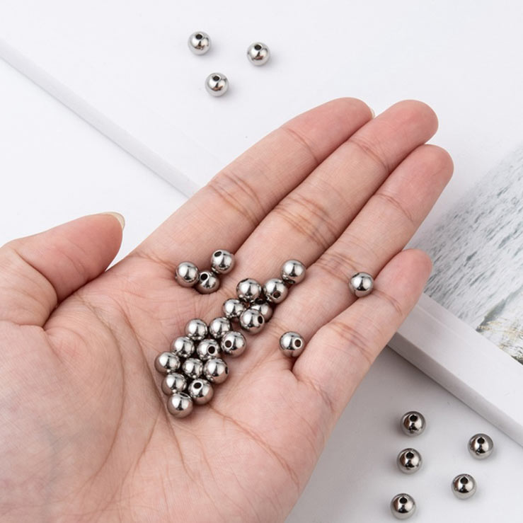 Bead of stainless steel, through-drilled, 6mm, 1.5mm hole, 2pcs.