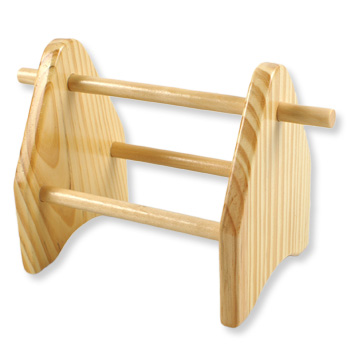 Wooden tool holder for storage of pliers.