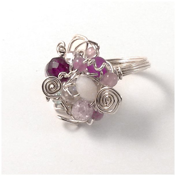 Finger ring made of silver wire with beads.