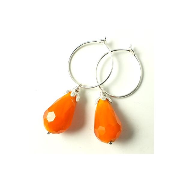 Silver hoop earrings with orange glass faceted teardrops and silver bead cups.