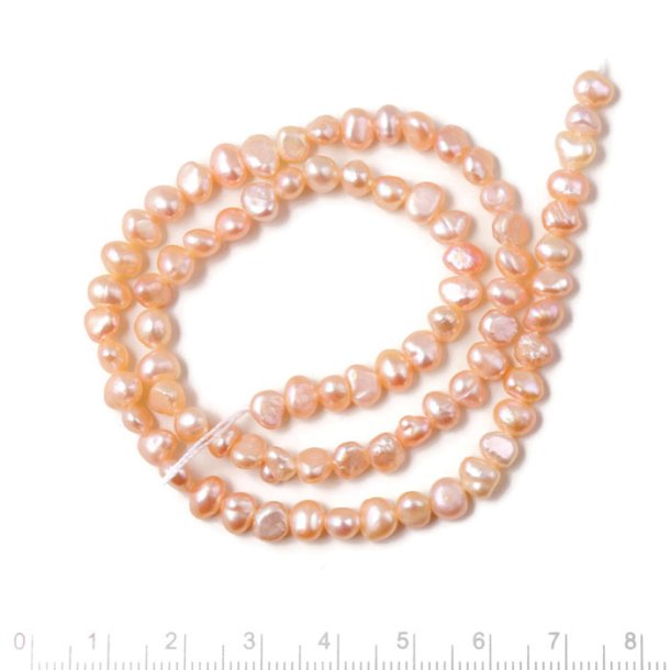 Freshwater pearl, full strand, baroque, peach, 6x7mm, A-grade, ca. 58pcs