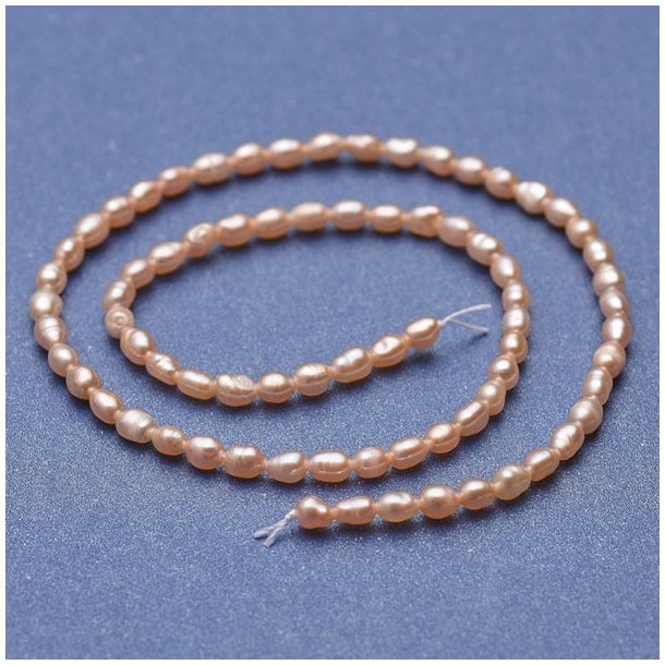 Freshwater pearl, full Strand, peach, rice, 5x3,5 mm, ca. 70pcs