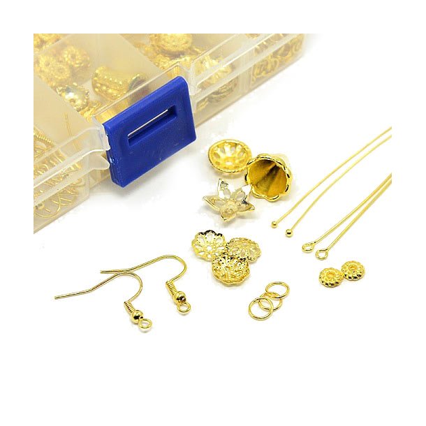 Material mix in box, headpins, ear hooks, bead caps, jumprings, gold-plated brass, 1 pc