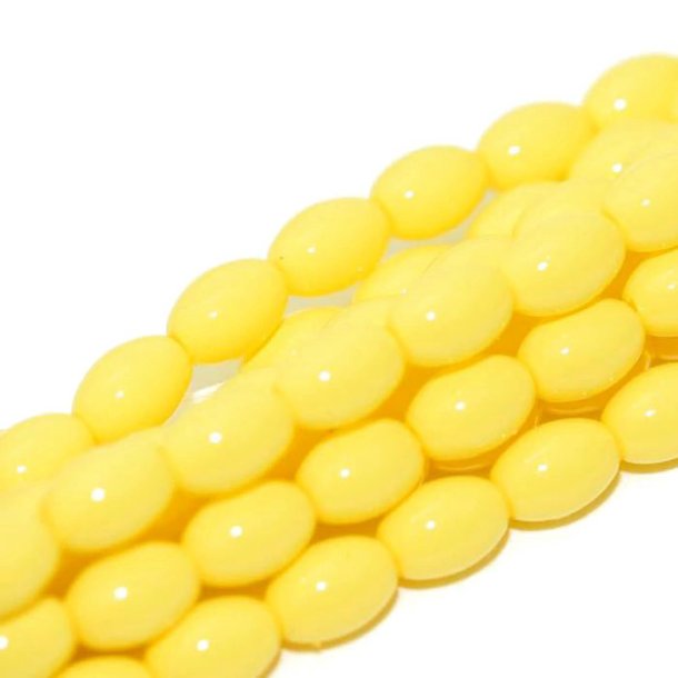 Glass beads, whole strand, rice-shaped, coated, yellow, 6x4 mm, approx. 100 pcs