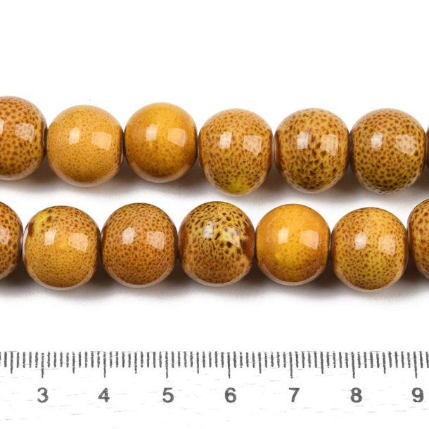 Keramikperle, hel perlestreng, karrygul, sp�ttet, rund, ca. 12 mm, ca. 30 stk