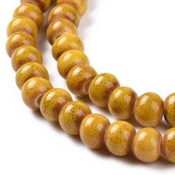 kleine Keramikperle, currygelb gesprenkelt, rund, ca. 6 mm, ca. 59 Stck