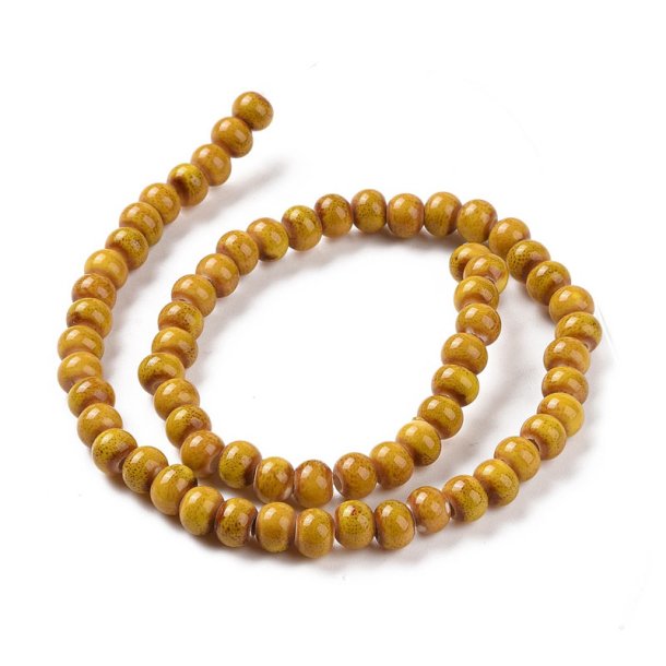 kleine Keramikperle, currygelb gesprenkelt, rund, ca. 6 mm, ca. 59 St�ck
