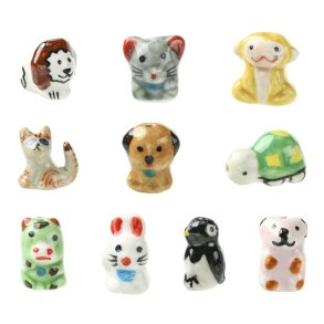 Tiere aus farbigem Porzellan: Hund, Katze, Affe, Pinguin, L�we u. a. 11 Stck