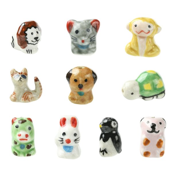 Tiere aus farbigem Porzellan: Hund, Katze, Affe, Pinguin, L�we u. a. 11 Stck