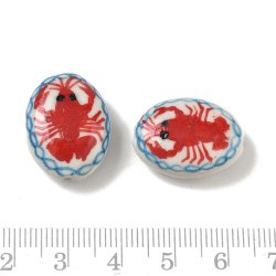 Porcelain perle, flad oval, bl�, hvid med r�d hummer, 21x16 mm, 2 stk