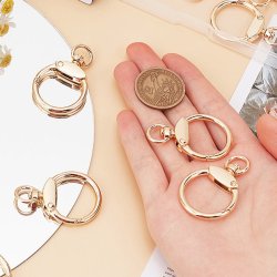 Karabinerverschluss mit Drehse, rund, vergoldetes Metall, 44x29 mm, 2 Stk