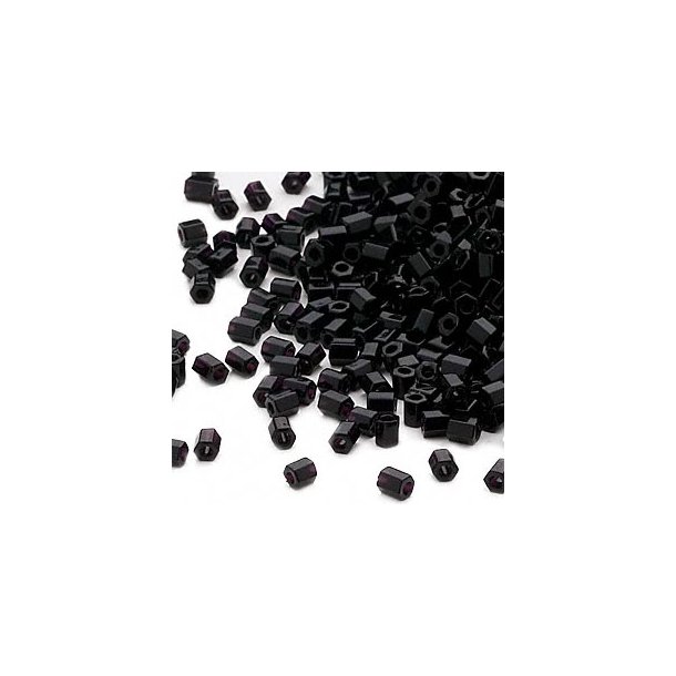 Delica, size #11, black hexagonal glass bead, opaque, 1.1x1.7mm, 5.2 grams.