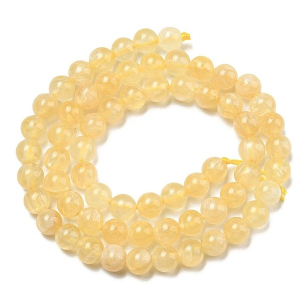 Honey Calcite, pastel yellow, whole strand, round bead, 6 mm, approx. 64 pieces