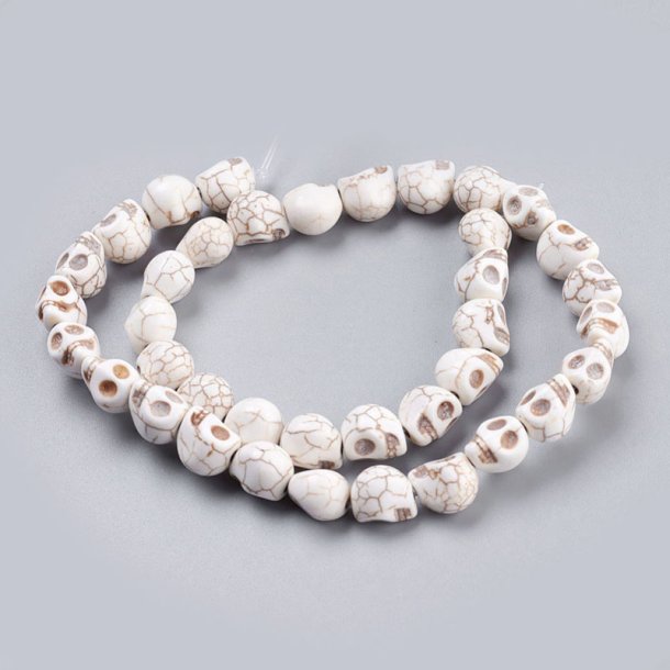 Pressed turquoise, full strand, antique white skull, 18x14x17 mm, appx. 18 pcs.
