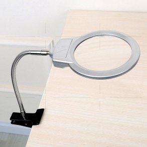 Magnifying glass with a flexible arm, table clamp and LED light.