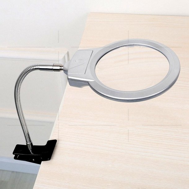 Magnifying glass with a flexible arm, table clamp and LED light.